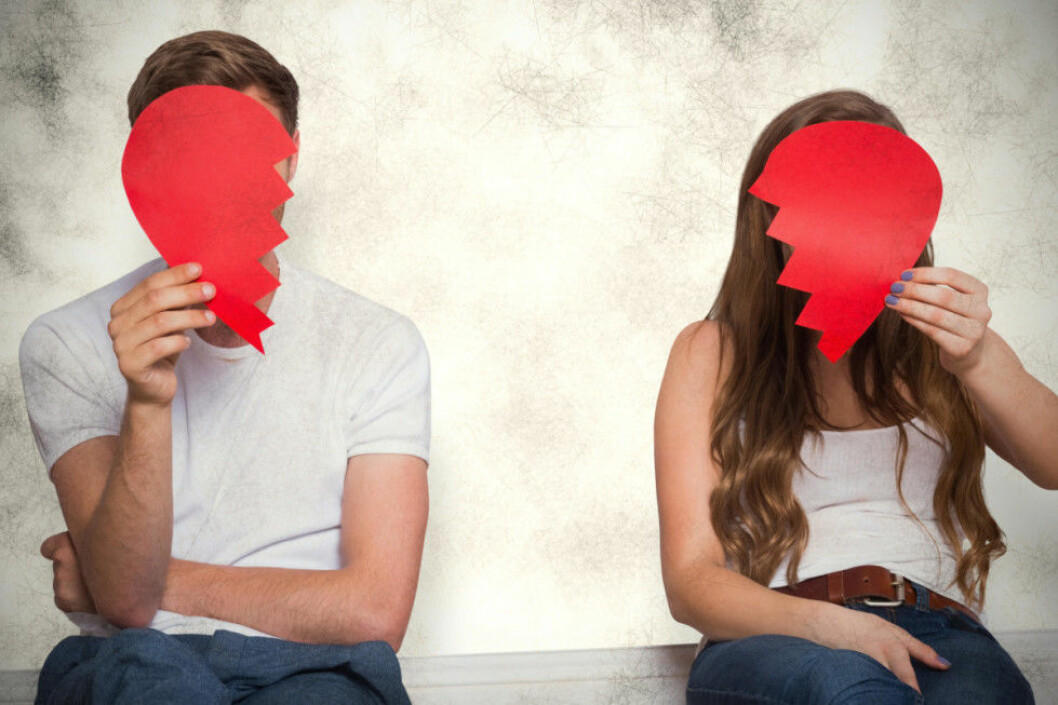 Composite image of couple holding broken heart
