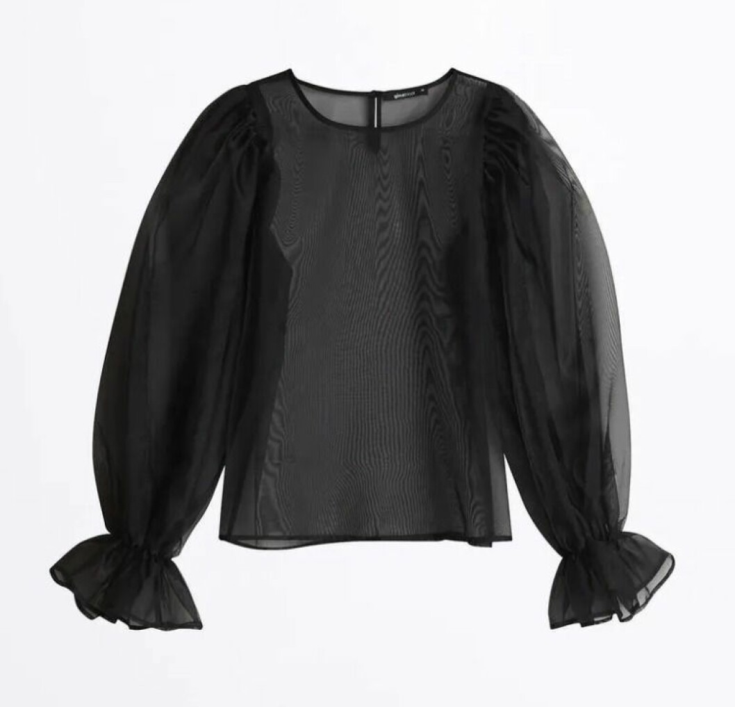 Svart festblus i transparent tyg