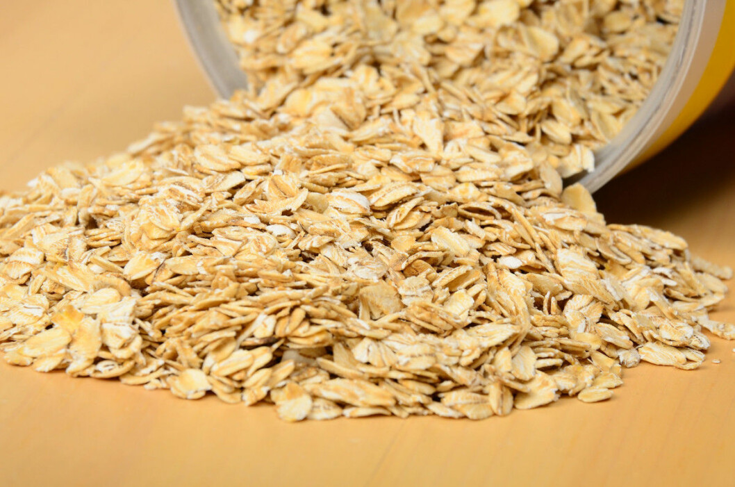 Oatmeal spilling out of bin. Selective focus on middle of pile.