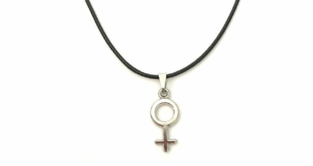 Halsband med svart band och kvinnosymbol