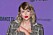 Taylor Swift i rutig kavaj och rött läppstift