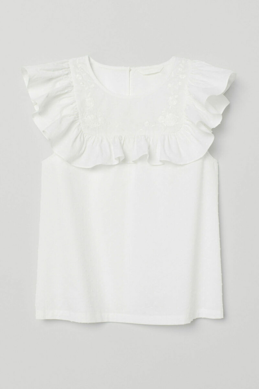 Vit blus med volanger